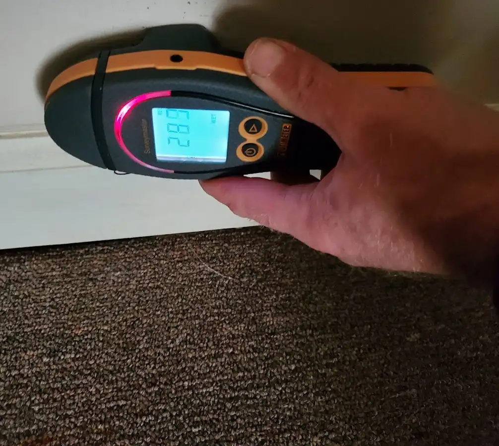 Moisture detection at baseboard during Storm Damage Restoration in Conneaut